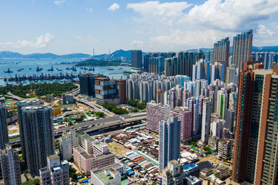 High angle view of buildings in city against sky