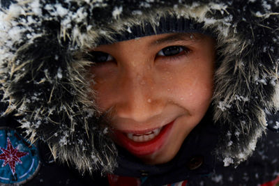 Close-up portrait of boy during winter