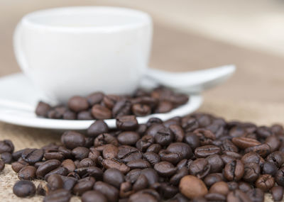 Close-up of coffee beans on table