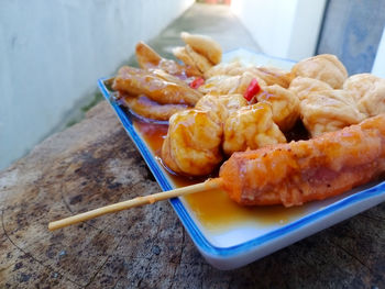 Close-up of serving food in plate on table