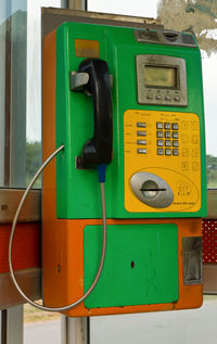 Close-up of telephone booth on wall