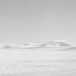 Scenic view of snowcapped landscape against sky