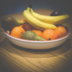 Close-up of fruits in bowl on table