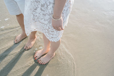 Low section of women on beach