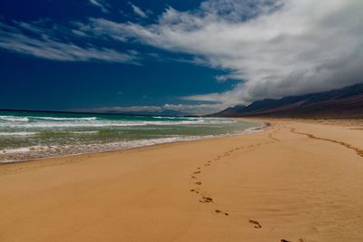 Scenic view of beach against sky