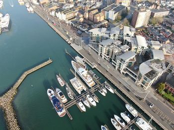 High angle view of harbor and buildings in city