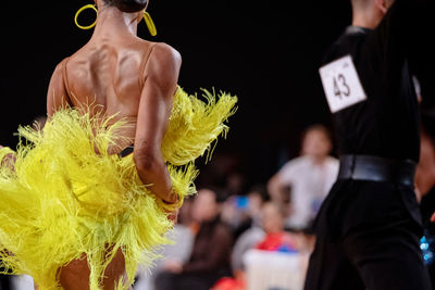 Couple dancers dancing cha-cha-cha in competition