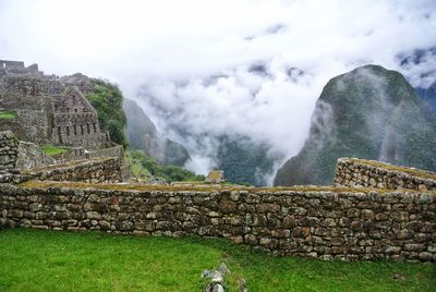 Scenic view of mountain against cloudy sky