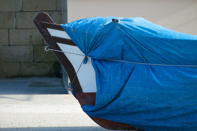 Close-up of wrapped boat on field