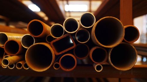 Close-up of metallic pipes at factory