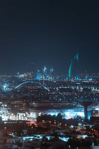 Illuminated buildings in city at night