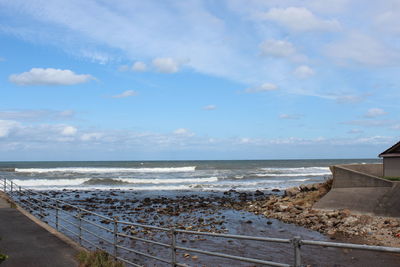 Scenic view of beach against sky