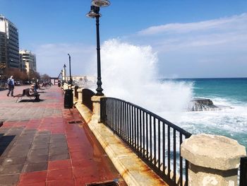 Street by sea against sky