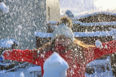 Boy playing with water splashing