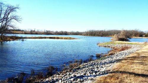 Scenic view of calm sea against clear sky