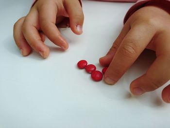 High angle view of baby holding hands