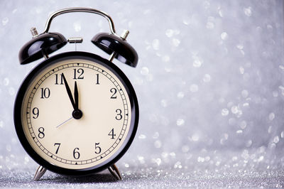 Close-up of clock on table