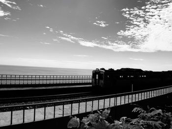 Train at railroad station against sky