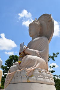 Low angle view of statue against sky