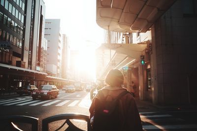 Rear view of man on street in city