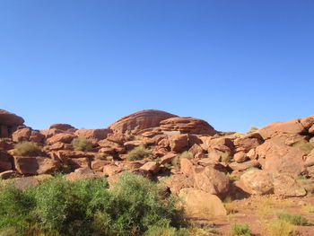 Scenic view of rocky mountains against clear blue sky
