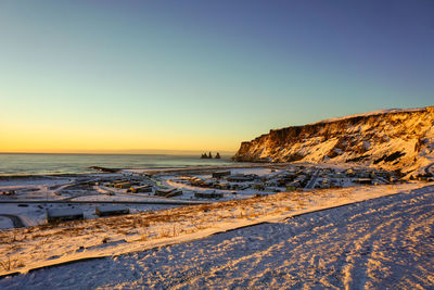 Scenic view of sea against clear sky during sunset