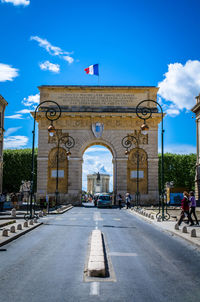 Porte du peyrou in city against sky
