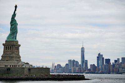 Buildings in city against sky