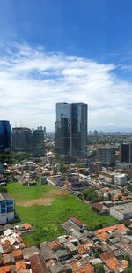 Modern buildings in city against sky