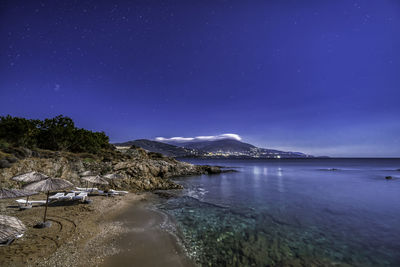 Scenic view of sea against sky at night