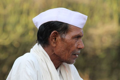 Close-up of mature man looking away