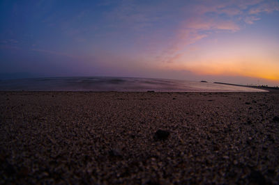 Scenic view of beach against sky during sunset