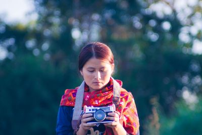 Portrait of boy photographing