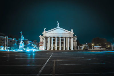 Low angle view of historic building in city at night