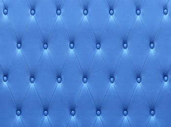 Pattern of blue leather seat upholstery use for background