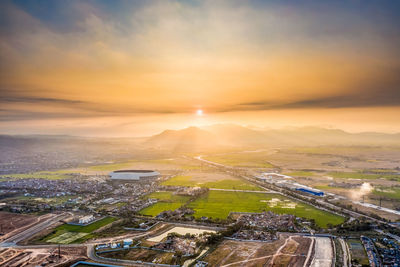 Aerial view of landscape against sky during sunset