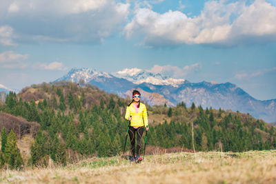 Full length of man standing on land against sky