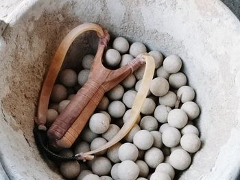 High angle view of pebbles in container