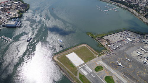 Aerial view of runway by sea