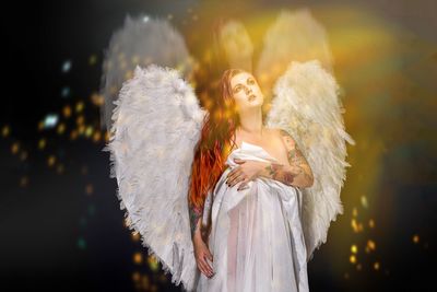 Seductive woman wearing angel costume