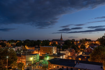 High angle view of illuminated buildings in city at night