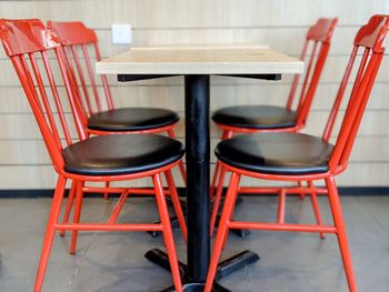 Empty chairs and table in restaurant