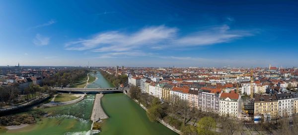 High angle view of river amidst buildings against sky