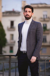 Portrait of young man standing outdoors