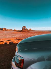 Scenic view of desert against clear blue sky