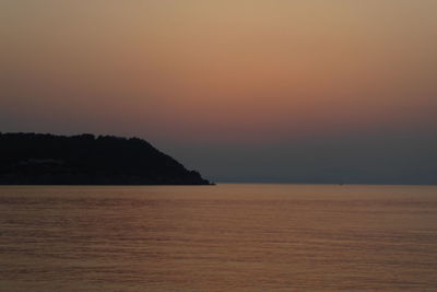Scenic view of sea against clear sky during sunset