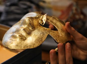 Close-up of hand holding sculpture