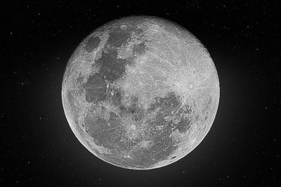 Low angle view of moon against sky at night