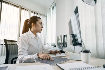 Man working on table at home