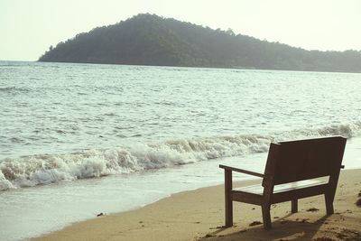 Scenic view of sea with mountain range in background